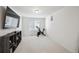 This is a bonus room with neutral carpet and wall-mounted tv at 10207 Xanadu St, Commerce City, CO 80022
