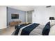 Comfortable bedroom with modern furnishings, a mirrored closet, and blue accents at 1020 15Th St # 7A, Denver, CO 80202