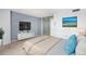 Bedroom with a large bed, flat screen tv, and mirrored closet doors, flooded with natural light at 1020 15Th St # 7A, Denver, CO 80202