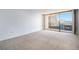 A bright, empty room with natural light streaming in from the balcony doors at 1020 15Th St # 7A, Denver, CO 80202