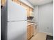 Kitchen featuring standard-sized appliances, light-colored cabinets, and basic countertops at 1020 15Th St # 7A, Denver, CO 80202