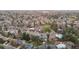 A beautiful aerial view of a neighborhood filled with mature trees and well-maintained homes at 3545 Cloverleaf Dr, Boulder, CO 80304