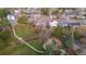 Aerial view highlighting paved walking paths, a bridge, and a playground within the picturesque Pine View Park at 3545 Cloverleaf Dr, Boulder, CO 80304
