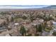 Scenic aerial view of homes surrounded by lush trees, offering a serene neighborhood atmosphere at 3545 Cloverleaf Dr, Boulder, CO 80304