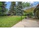 Large grassy backyard featuring a covered patio perfect for outdoor entertaining at 3545 Cloverleaf Dr, Boulder, CO 80304