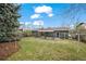 Large backyard featuring a well-maintained lawn, covered patio, and privacy fencing at 3545 Cloverleaf Dr, Boulder, CO 80304