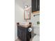 Bathroom features dark vanity, bright white fixtures, and modern mirror at 3545 Cloverleaf Dr, Boulder, CO 80304