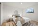 Cozy bedroom featuring a queen bed, stylish decor, and a sunlit window at 3545 Cloverleaf Dr, Boulder, CO 80304