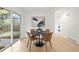 Bright dining area features a modern table set and sliding door to the outdoors at 3545 Cloverleaf Dr, Boulder, CO 80304