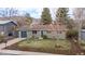 Attractive single-Gathering home with fresh landscaping, mature trees, and a blue accent garage at 3545 Cloverleaf Dr, Boulder, CO 80304