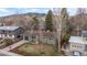 Charming exterior view of home with mature trees, blue accents, and mountain backdrop at 3545 Cloverleaf Dr, Boulder, CO 80304