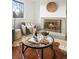 Cozy living room showcasing a brick fireplace with a decorative woven basket accent at 3545 Cloverleaf Dr, Boulder, CO 80304