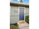 Close up of front door with an attractive blue accent, stylish number plate, and well-kept landscaping at 3545 Cloverleaf Dr, Boulder, CO 80304