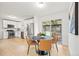Open kitchen and dining area with stainless steel appliances and backyard access at 3545 Cloverleaf Dr, Boulder, CO 80304