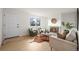 Bright and airy living room with a cozy fireplace, modern furnishings, and hardwood floors at 3545 Cloverleaf Dr, Boulder, CO 80304