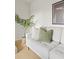 Comfortable living room featuring a stylish couch, plant, and framed artwork at 3545 Cloverleaf Dr, Boulder, CO 80304