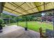 Spacious covered patio overlooking the lush green backyard at 3545 Cloverleaf Dr, Boulder, CO 80304