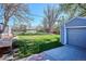 Large backyard featuring a storage shed, lush lawn, and outdoor living spaces, perfect for entertainment at 4920 Clay St, Denver, CO 80221