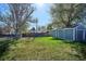Large, fenced backyard featuring a storage shed and plenty of green space at 4920 Clay St, Denver, CO 80221