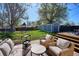 Inviting outdoor patio area featuring comfortable wicker furniture, ideal for relaxation and social gatherings at 4920 Clay St, Denver, CO 80221