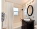 Bathroom with shower-tub, vanity, mirror, and new light fixture at 4920 Clay St, Denver, CO 80221