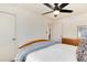 Inviting bedroom featuring a comfortable bed, ceiling fan, and ample closet space at 4920 Clay St, Denver, CO 80221