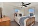 Bright bedroom with two windows, ceiling fan, and wood furnishings at 4920 Clay St, Denver, CO 80221