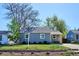 Charming home featuring a well-maintained lawn and a freshly painted exterior in a desirable neighborhood at 4920 Clay St, Denver, CO 80221