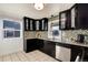 Bright kitchen with granite countertops, mosaic backsplash, and stainless steel appliances at 4920 Clay St, Denver, CO 80221