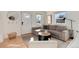 Cozy living room featuring a comfortable sectional sofa, round coffee table and natural light at 4920 Clay St, Denver, CO 80221