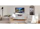 Living room features a media center, stylish decor, and view into another room at 4920 Clay St, Denver, CO 80221