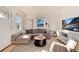 Sunlit living room with comfortable seating, stylish decor, and a relaxing ambiance at 4920 Clay St, Denver, CO 80221