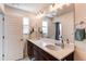 Bathroom with a dual sink vanity and a large mirror at 8361 Parkland St, Broomfield, CO 80021