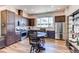 Modern kitchen with stainless steel appliances and breakfast bar table at 8361 Parkland St, Broomfield, CO 80021