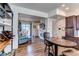 Spacious living room with modern decor, fireplace and access to outdoor patio at 8361 Parkland St, Broomfield, CO 80021