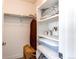 Walk-in closet features built-in shelves and rod for ample storage and organization at 8361 Parkland St, Broomfield, CO 80021