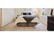 Cozy bedroom with a soft carpet, a large dresser and a window at 3343 S Monaco Pkwy # A, Denver, CO 80222
