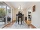 Dining area with sliding glass doors leading to the backyard and open to the kitchen at 3343 S Monaco Pkwy # A, Denver, CO 80222