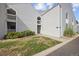Multi-level townhome with green lawn, manicured bushes, and classic vinyl siding at 3343 S Monaco Pkwy # A, Denver, CO 80222