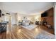 Comfortable living room with a fireplace and wood-look flooring at 3343 S Monaco Pkwy # A, Denver, CO 80222
