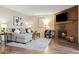 Inviting living room featuring a brick fireplace and neutral toned decor at 3343 S Monaco Pkwy # A, Denver, CO 80222