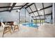 Features an indoor pool with high ceilings, large windows and chairs at 3343 S Monaco Pkwy # A, Denver, CO 80222