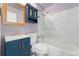 A bathroom with a sink, toilet, bathtub, shower with glass doors and a medicine cabinet at 525 Jackson St # 304, Denver, CO 80206