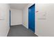 A hallway of an apartment building featuring doors and gray carpet at 525 Jackson St # 304, Denver, CO 80206