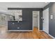 Open living space with modern kitchen, walk-in closet, and hardwood flooring at 525 Jackson St # 304, Denver, CO 80206