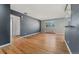 Spacious living area boasting hardwood floors, a large window, and neutral paint at 525 Jackson St # 304, Denver, CO 80206