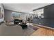 Inviting living room featuring an open layout, hardwood floors, and contemporary decor at 525 Jackson St # 304, Denver, CO 80206