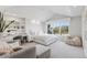 Bright bedroom with a serene sitting area, and a large window overlooking the greenery at 4475 S Downing St, Cherry Hills Village, CO 80113