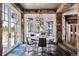Charming dining area with large windows, stone accents, and a round table perfect for entertaining guests at 4475 S Downing St, Cherry Hills Village, CO 80113