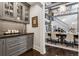 Elegant dining room features a grand staircase, stone accents, and stylish chandelier for luxurious meals at 4475 S Downing St, Cherry Hills Village, CO 80113